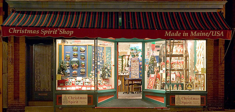 Night view of Christmas Spirit&reg; Shop storefront